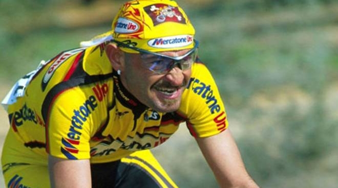 Marco Pantani, in un ghigno di fatica e agonismo. Fonte foto: Il Resto del Carlino